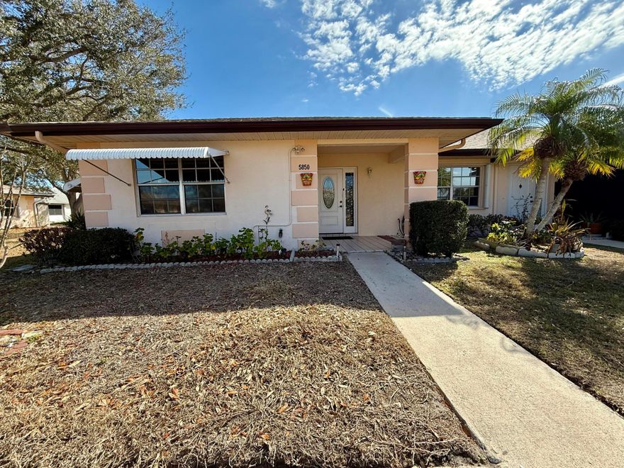 Updated, end unit is now available in the sought after, 55+ community, The Grove. Coming fully furnished & turnkey, all you need is your personal items and to stop at the grocery store! Located directly across the street, you are just a few steps from the community amenities like the pool, tennis courts, shuffleboard & more! 6 month rental is required but will consider an annual rental as well. Monthly rental amount includes everything: electric, cable, internet & water!! Handicap bars are installed in bathrooms making accessibility a breeze. 24 hour manned security gate & active social calendar at the clubhouse. Located between Ft Pierce & Port St Lucie you are just a short drive to either cities local shopping, dining & beaches!