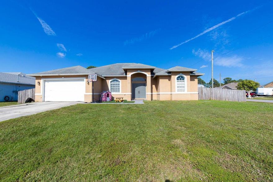 MOTIVATED SELLERS!!!Beautiful corner-lot 3BR/2BA home in one of PSL's most desirable neighborhoods! Spacious open living areas, vaulted ceilings, and a HUGE kitchen with tons of storage. The primary suite features his & her walk-in closets. Step through 3 sliding doors to a backyard ready for a pool or your dream projects, plus a utility vehicle gate. Tons of potential and motivated sellers! Friendly neighbors, great community, and endless possibilities--your paradise awaits!