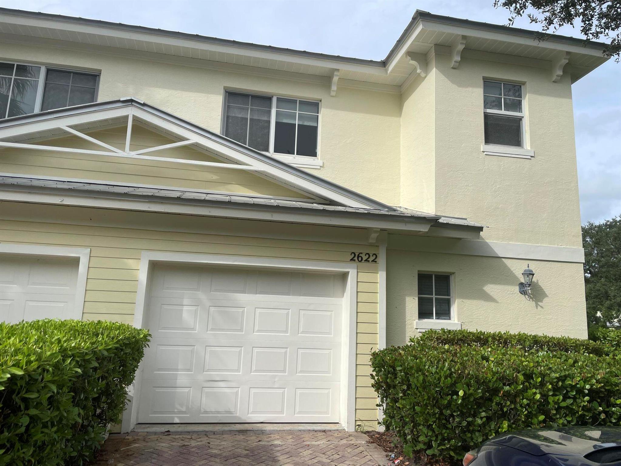 Desirable corner unit in the beautiful River Oaks community along the St. Lucie River! This stunning 4BR/2.5BA townhouse features one bedroom on the main level and three upstairs. Enjoy soaring ceilings, brand new flooring, white curtains, LED lighting, granite countertops, and brand new stainless steel appliances. A/C recently serviced. Includes a one-car garage, outdoor parking, and extra storage. All rooms are spacious and filled with natural light--plus unbeatable green views from the back bedrooms. One bathroom includes a Roman tub. Pet friendly and impeccably maintained!