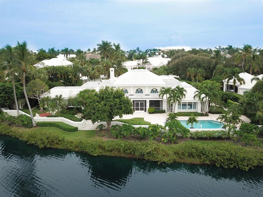 Terrific views Pelican Lake. Located on the cul-de-sac. 4 bedrooms plus a study. Built by Turtle Beach Construction with beautiful crown and dental molding. Volume ceilings throughout. Private pool an sun deck. Fireplace. On more than half an acre. Short walk to Beach Club and tennis.