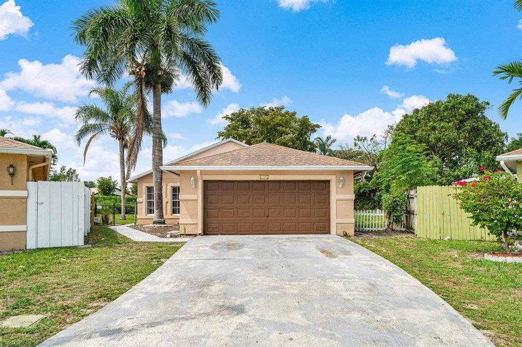Three bedroom, two bath, two car garage single family home centrally located in Boynton Beach convenient to everything. Updated interior featuring tile and laminate flooring throughout. New stainless-steel appliances, new washer/dryer. Split floorplan with vaulted ceilings in the main living area. Generously sized master bedroom with walk in closet. Inside laundry. Very large backyard and covered patio. 2016 AC and 2017 water-heater. Home located close to community pool.