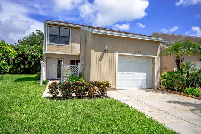 Just reduced! Outside being painted by association in the near future. Located in Central Boca, A-rated schools, 1 car garage, 3 bed/ 3 full baths town home with private balconies and a fireplace. Neutral colors, freshly painted inside, newer AC, 3 new bath vanities, new light fixtures, newer garage door, central vac, and new carpet. Private patios and sundeck off the master bedroom. Great investment property, can be rented quickly. 1 full bedroom and 1 bath downstairs, 2 bed/ 2 baths upstairs. Pets allowed. 1 large dog, 1 smaller animal.