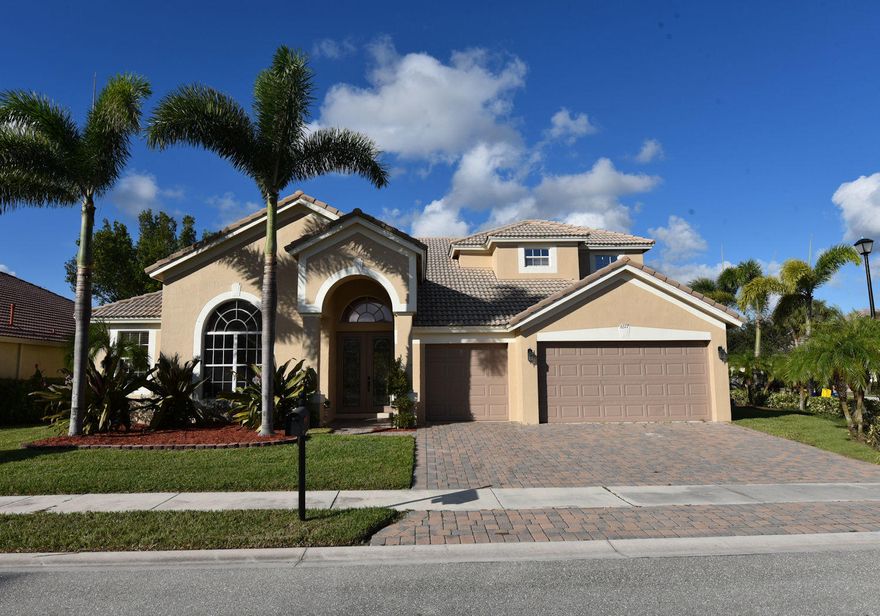 Stunning 6 bedrooms, 4 bathroom home in a very sought after gated community Hamilton Bay. Everything in this home has been completely remodeled with Modern Finishes coffered ceilings crown molding. New Master Bedroom and bath,New wood flooring thru out the home. New Chef's kitchen with built in wine cooler upgraded kitchen cabinets. Large laundry room with laundry sink. Everything you could possibly want is in this home. Huge closed storage room off big loft upstairs. House sits on a corner lot .024 just shy of a quarter acre. Property is lined with beautiful Royal Palms. Don't hesitate nothing will compare to this 6 bedroom home on the market for this price only 5 homes have sold in this community since December 2016. Only one other home for sale in community that doesn't even compare!!!