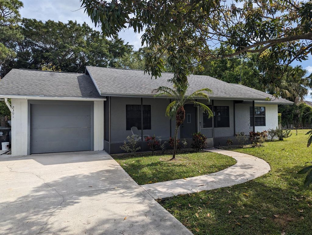 Photo of 2391 SE Harrington Avenue, Port Saint Lucie, FL 34952 (MLS # R10974995)