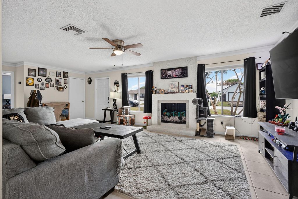 Photo of 2289 SE Carnation Road, Port Saint Lucie, FL 34952 (MLS # B26015953)