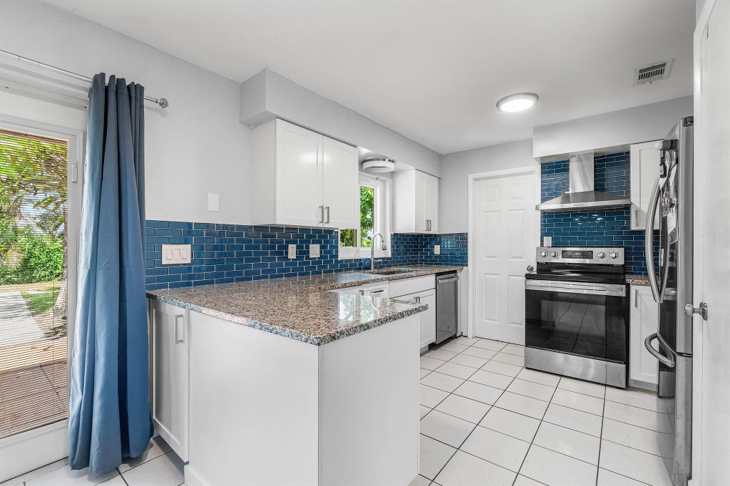 Photo of 1179 Fernlea Drive, West Palm Beach, FL 33417 (MLS # R11126190)