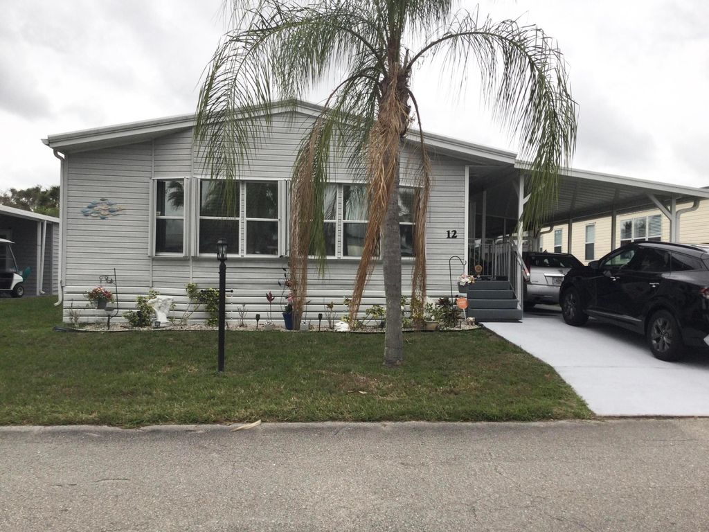 Photo of 12 S Granada Lane, Port Saint Lucie, FL 34952 (MLS # B26002476)