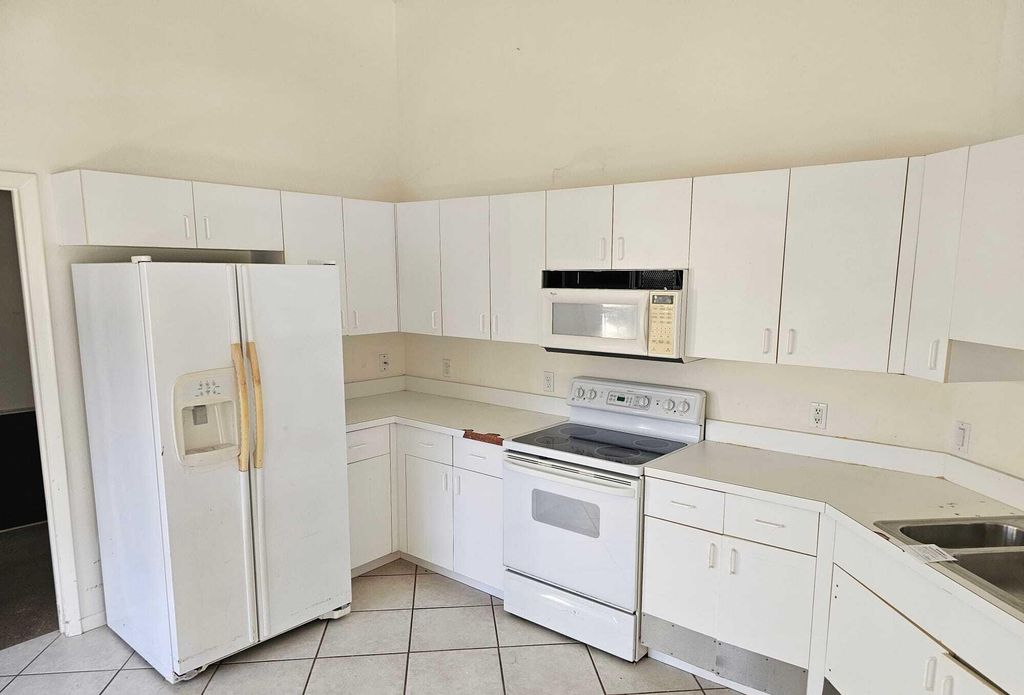 Photo of 1158 NW Lombardy Drive, Port Saint Lucie, FL 34986 (MLS # R10944223)