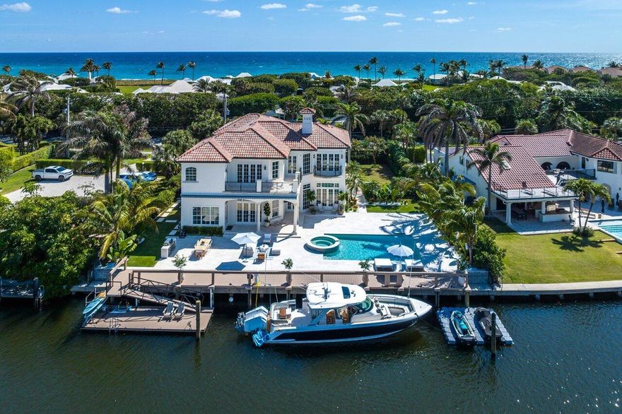 Nestled along the pristine shores of Ocean Ridge this home presents a rare opportunity for luxurious intracoastal and beach living. This meticulously designed residence with 5 bedrooms, an office/gym and 6 full and 2 half baths is situated on an impressive lot boasting 115 feet on the water, offers an expansive waterfront experience. The thoughtful design ensures breathtaking waterfront views from almost every room in the home, creating a seamless connection between indoor living spaces and the stunning surroundings.Inside features extensive custom millwork, teak built-ins, an eat-in kitchen, and airy coastal vibes throughout, with nice touches of chrome fixtures to give you that coastal, nautical feel.