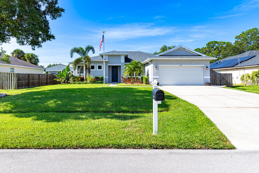 Beautifully maintained CBS home with no HOA, nestled on a quiet street. This 3-bedroom property includes a flex room with French doors, perfect as a home office or optional 4th bedroom. Step outside to your own backyard oasis featuring a saltwater pool with a screen enclosure and fully fenced yard, ideal for entertaining or relaxing.Built in 2021, this home offers granite countertops, 42'' kitchen cabinets, wood-look ceramic tile in the main living areas, and 8' interior doors throughout. The Tesla Solar Power System (9.6 kW with two Powerwall batteries) is paid off, fully transferable, and includes a warranty. The system provides excellent energy efficiency and backup power during outages, with an average electric bill of just $25/month.