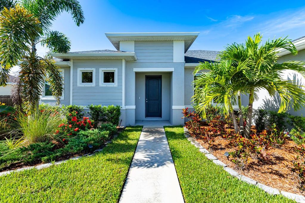 Photo of 1058 SW Dartmouth Avenue, Port Saint Lucie, FL 34953 (MLS # R11106434)