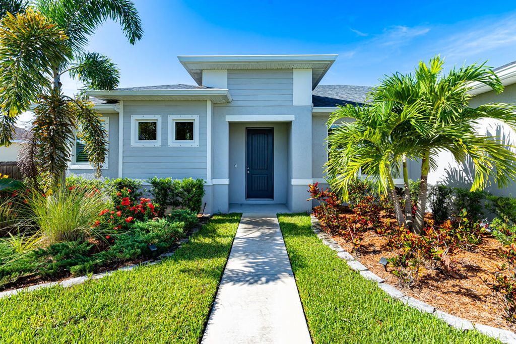 Photo of 1058 SW Dartmouth Avenue, Port Saint Lucie, FL 34953 (MLS # R11106434)