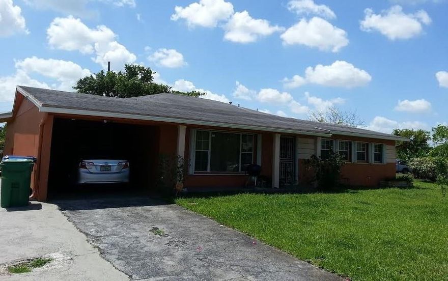 STOP THE CAR! Cosmetic tlc aside,the whole back of the home is one large extension! (permits pulled) Possible AU PAIR suite. 5 bdrms. Man cave, 2012 roof, new exterior paint, newer windows and dual zone A/C. Got kids? Put'em on the other side of the house! It even has accordion hurricane shutters. No stairs if you have bad knee's. The fenced corner lot will accommodate a pool, boat or RV if you like.No HOA. And yes, it's close to shopping. Your family will love it.  Hurry...Its waiting on YOU!