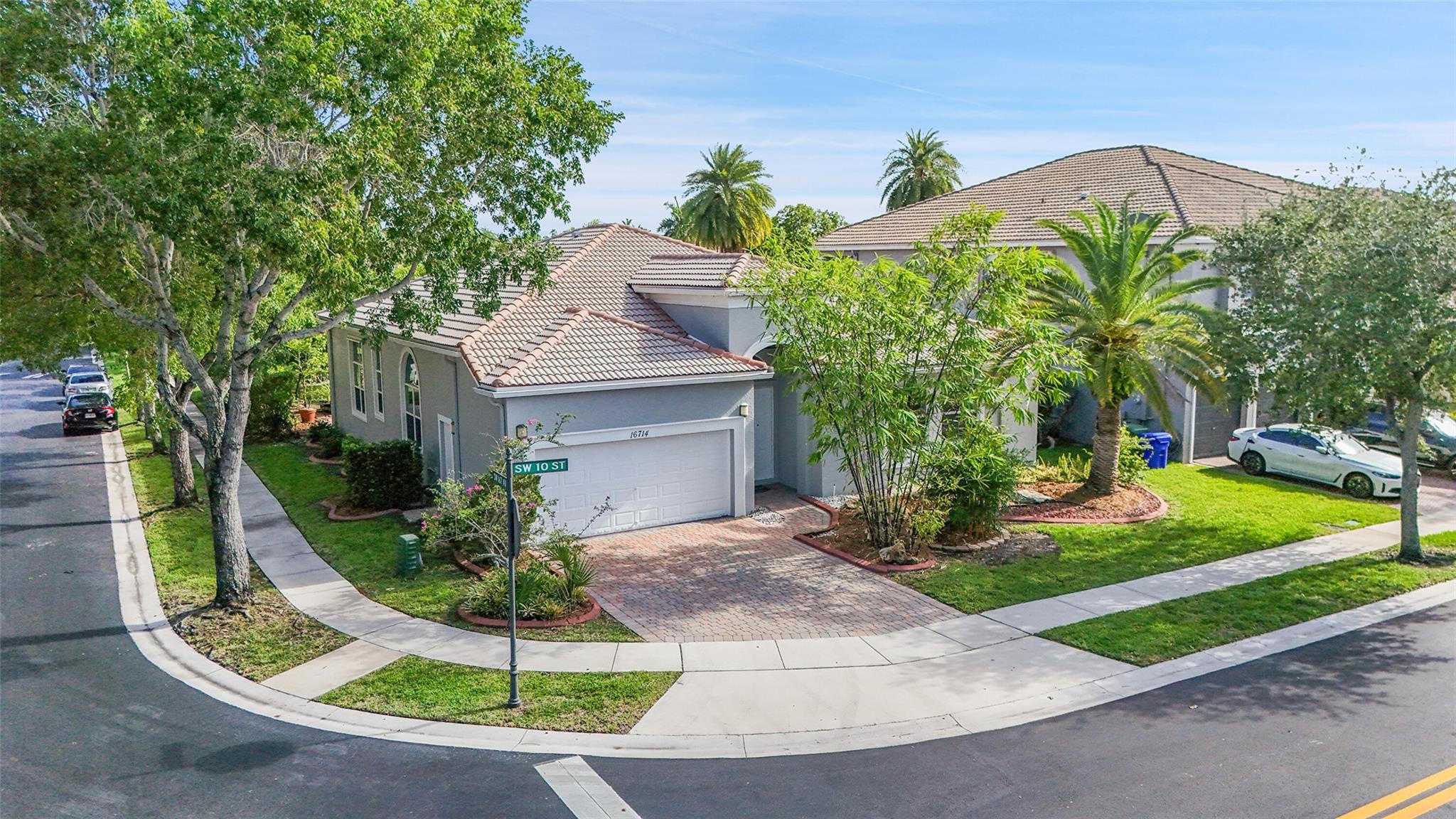 Welcome to the Resort Style Gated Community of Lido Isles. Entering the home, you will be in awe of the High Volume Coffered Ceilings with recessed lighting. This stunning home has a separate dining room, interior laundry, spacious kitchen w/ large island, pantry, breakfast nook, white quartz counters, and stainless appliances. The breakfast nook & living room have French glass doors leading out to the covered patio & beautiful back yard boasting mature landscaping & lake view. The primary bedroom is located at the rear of the house & overlooks the lake & covered patio & features his & hers walk-in closets, The Primary bathroom has a walk-in shower, garden tub, & double sinks. Community offers a pool, gym, & playground & is near hospital, restaurants, shopping & I-75 + top rated schools