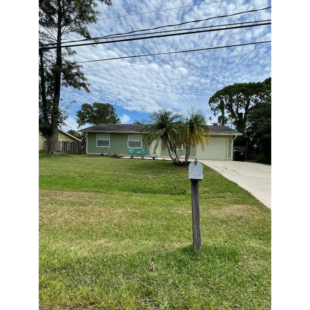 Photo of 407 SW Duval Avenue, Port St Lucie, FL 34983 (MLS # R10904980)