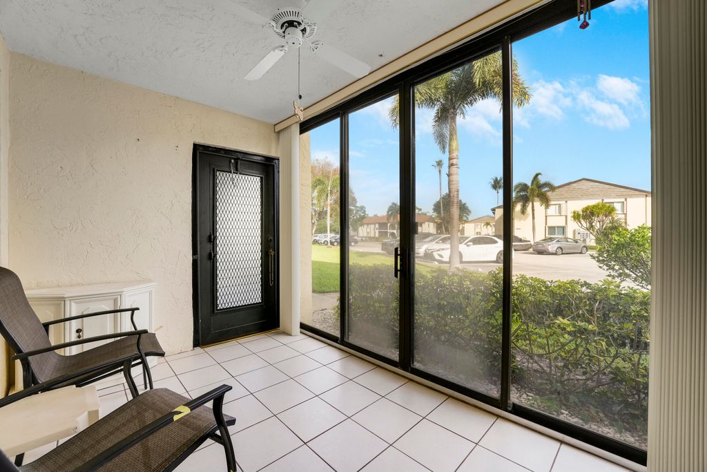 Photo of 5900 Whispering Pine Way #A-1, Greenacres, FL 33463 (MLS # B26008141)