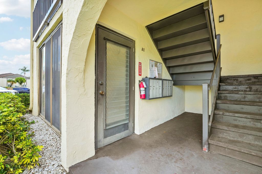 Photo of 5900 Whispering Pine Way #A-1, Greenacres, FL 33463 (MLS # B26008141)