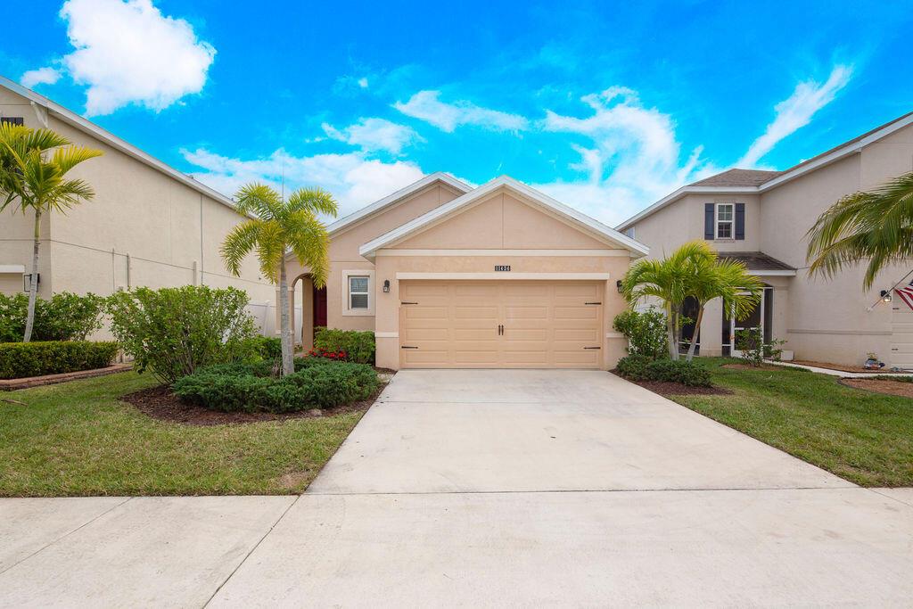 Discover this beautiful Allex Model home in the desirable Victoria Parc Manors! This 3-bedroom, 2-bath residence with a 2-car garage offers modern living with plank tile floors throughout. The kitchen features elegant dark cabinetry and sleek stainless-steel appliances. The spacious master suite includes a walk-in closet and an ensuite bathroom with double sinks and a walk-in shower. Two additional bedrooms provide plenty of space, and the second bathroom features a convenient shower/tub combination. A dedicated laundry room comes complete with a washer and dryer for added convenience. Located in the heart of Tradition, you'll love the proximity to shopping, dining, and entertainment. HOA includes perks like cable, internet, lawn care, and exterior pest control.