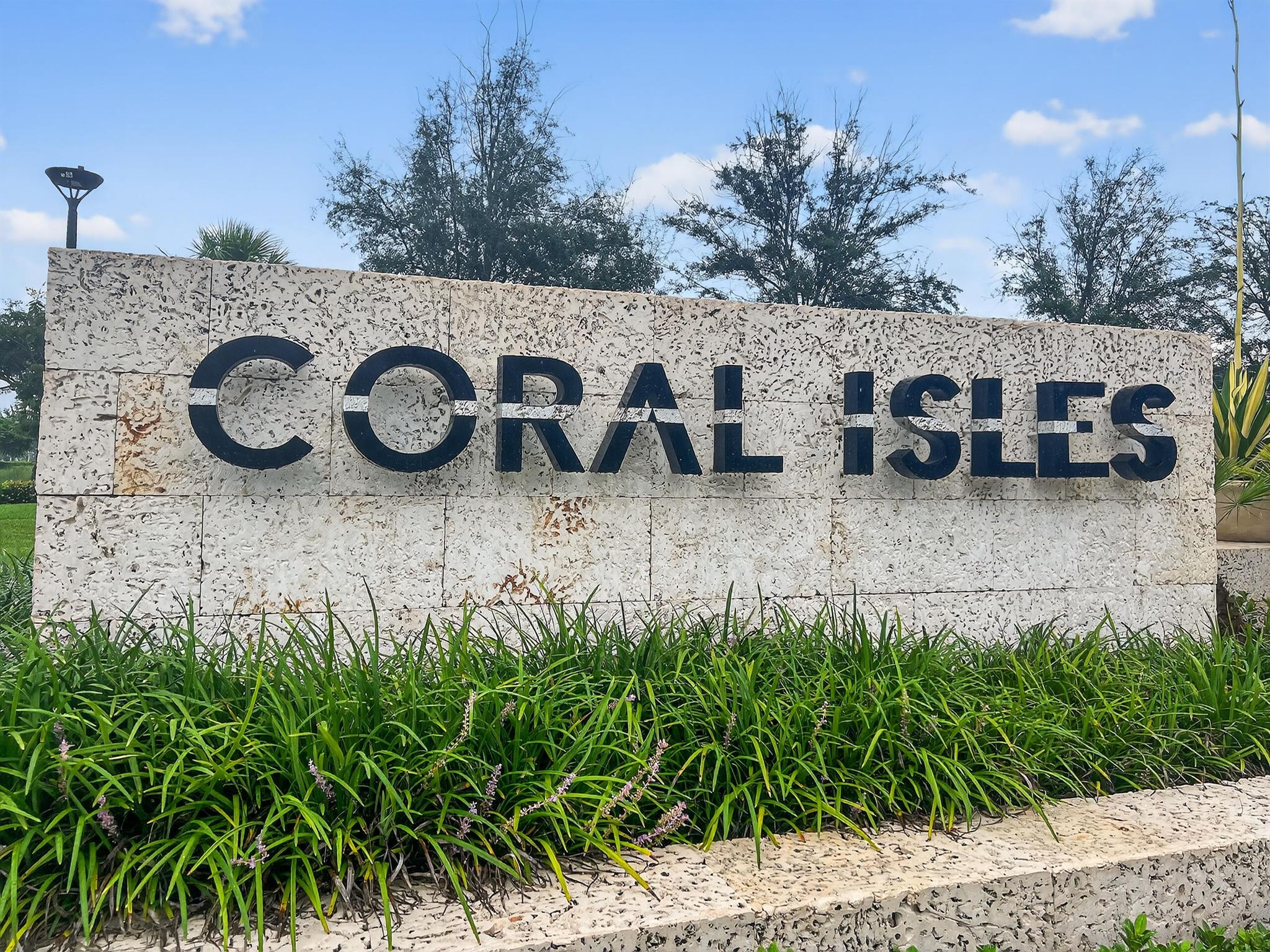 A breathtaking masterpiece of refined Florida living, this brand-new, two-story estate at Coral Isle Circle is the pinnacle of luxury within Palm Beach Gardens' newest and most exclusive enclave, Coral Isles at Avenir. Every detail of this 5-bedroom, 5.5-bathroom home has been meticulously curated to deliver a seamless blend of modern elegance and unparalleled comfort.From the moment of arrival, the home makes a powerful statement. A stately paver driveway guides you to the expansive 3-car garage, while the meticulously manicured tropical landscaping, illuminated by a professional landscape lighting system, creates a captivating prelude to the grandeur within.Step through the double front doors into an impressive foyer, where soaring ceilings and expansive windows bathe