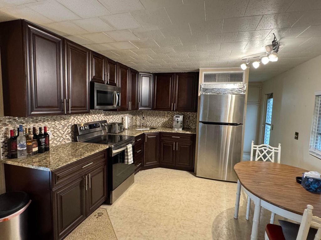 Photo of 8926 Palm Street, Boynton Beach, FL 33436 (MLS # R11053886)