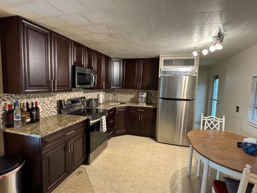 Charming, and well cared for 2bedroom and 1,5 BA, move-in ready fully furnshed mobile/mfg home in a 55+ community. DEEDED lot-no land lease! Low HOA ($1200 per year)incl. water w/community treatment. Remodeled Eat-in kitchen with new appliances and plenty of storage.. Relax on the oversized covered patio/ carport.Stackable washer and Dryer in second bathroom. Shed in the back for your tools . Perfect for season or year round living.Clubhouse offers social activities, shuffleboard, arts & crafts, BBQ grill. No lease 1st 3 yrs., No RVs, no trucks, no vehicles w/advertising.Enjoy  beaches ( less than 10 min drive)shopping, dining, close to hospital and airport.CASH ONLY