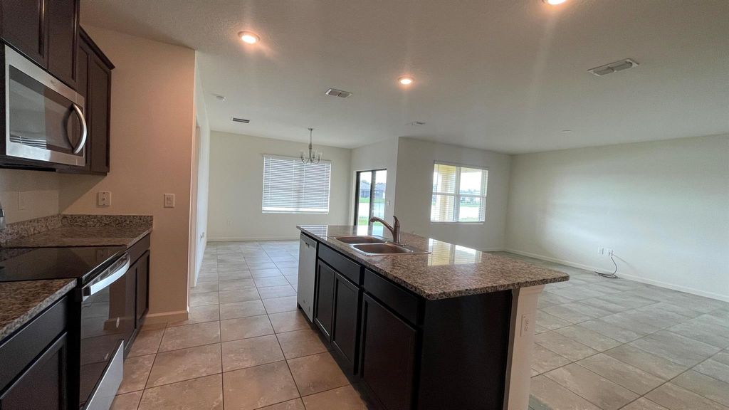 Photo of 6444 NW Castlebrooke Avenue, Port Saint Lucie, FL 34983 (MLS # R11035109)