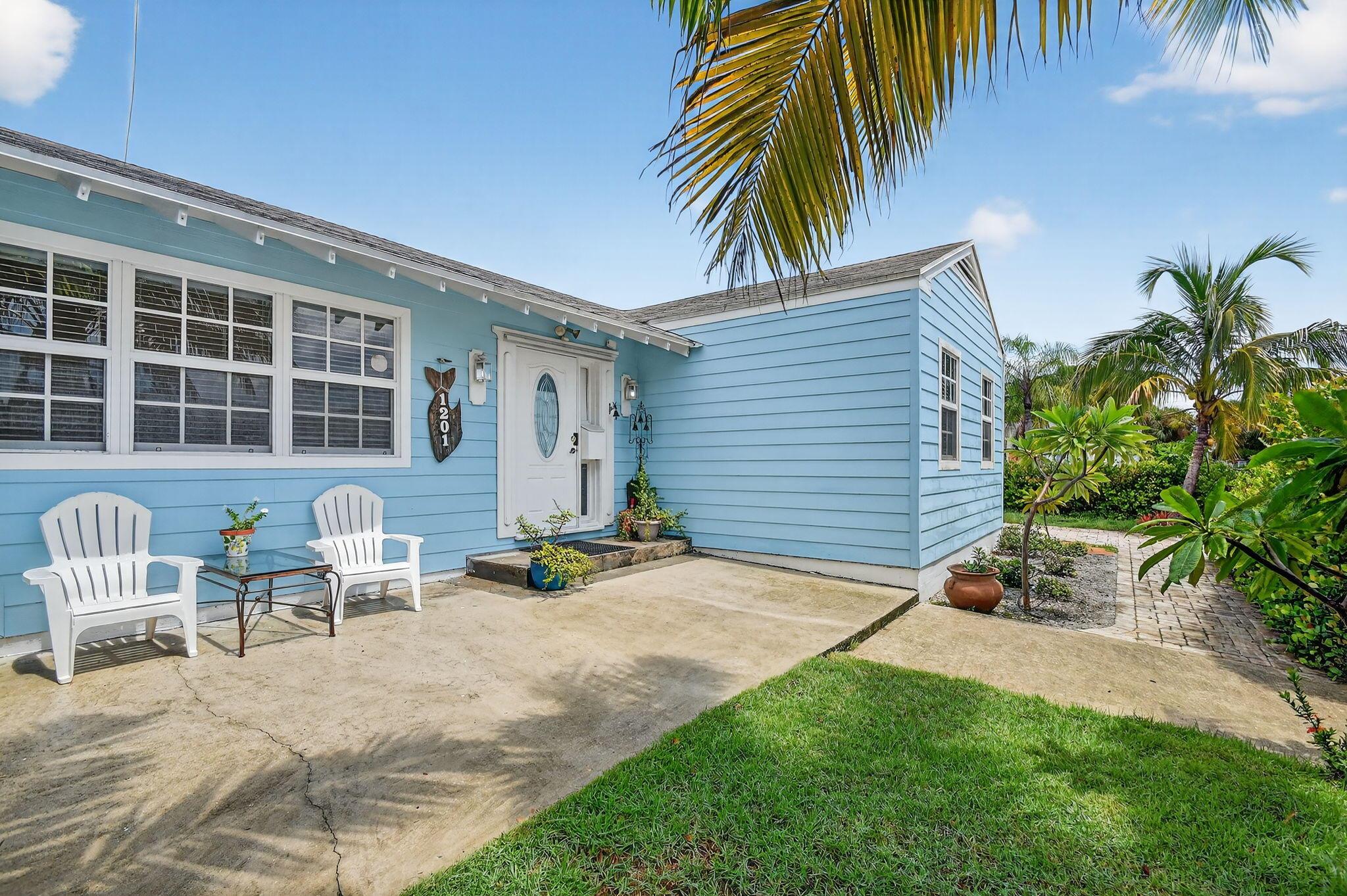 Charming single-family corner home in Lake Worth Beach! Featuring beautiful wood floors, a bright kitchen with a separate dining area, and plenty of natural light throughout. Enjoy peace of mind with impact windows, a 2017 A/C, and a brand-new roof currently being installed. This home also offers a spacious work room, a two-car driveway, and both a backyard and side yard! Minutes from the intracoastal. A true blend of character and comfort!