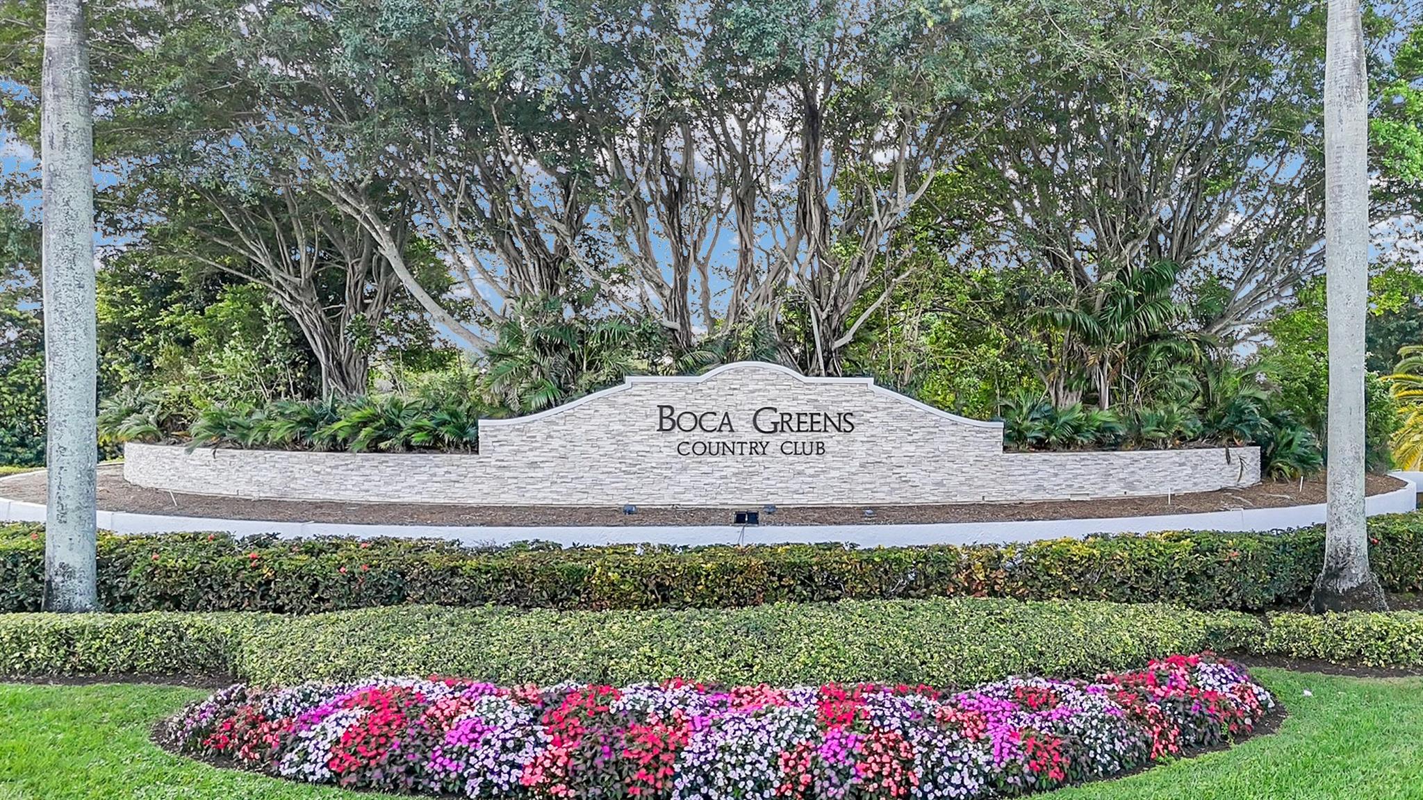 Rare find in Estate Section of Boca Greens.Brand new roof and complete hurricane impact windows, plus new A/C's. Pie shaped .36 acre lot with circular driveway. Lots of space future additions. Professional gas stove and subzero in beautifully remodeled kitchen ideal for Gourmet cooks with appliance garage. Built in Costa Rican Mahogany 10 seat table with retractable door. Built in wine cooler with room for 54 Bottles. Master bedroom overlooks patio, and has 2 walk-in closets, and large bathroom with tub and separate shower. Large screened in Patio with DCS outdoor kitchen. Beautiful outdoor area with pool with expansive view of the 14th hole fairway. Fenced yard.Gated community.