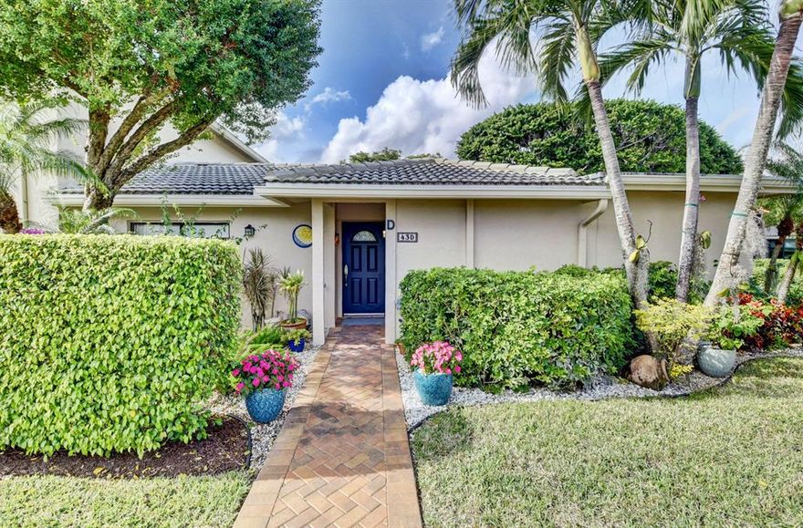 Stop!!! Don't Miss This One of a Kind Villa!! Beautifully Landscaped Entrance. Totally Updated Stunning 48'' X 18'' Porcelain Tile Throughout.  Open Chef's Kitchen , Granite Counters, Glass Tile Backsplash. This Stunning Villa Features Crown Molding, Smooth Ceilings, Impact Glass Enclosed Florida Room Overlooking the Lake and Golf in the Distance. Primary has EnSuite Bathroom, Double Sinks, Large Step In Shower With Glass Barn Door Closure. This Unique Villa Boasts an Additional Bedroom/Den. Open Side Patio for BBQ .Guest Bedroom w/Glass Sliders to Private Patio, Newer A/C & Hot Water Heater, But Wait... Seller has Contracted to Build a Golf Cart Garage with Access From Side Patio.