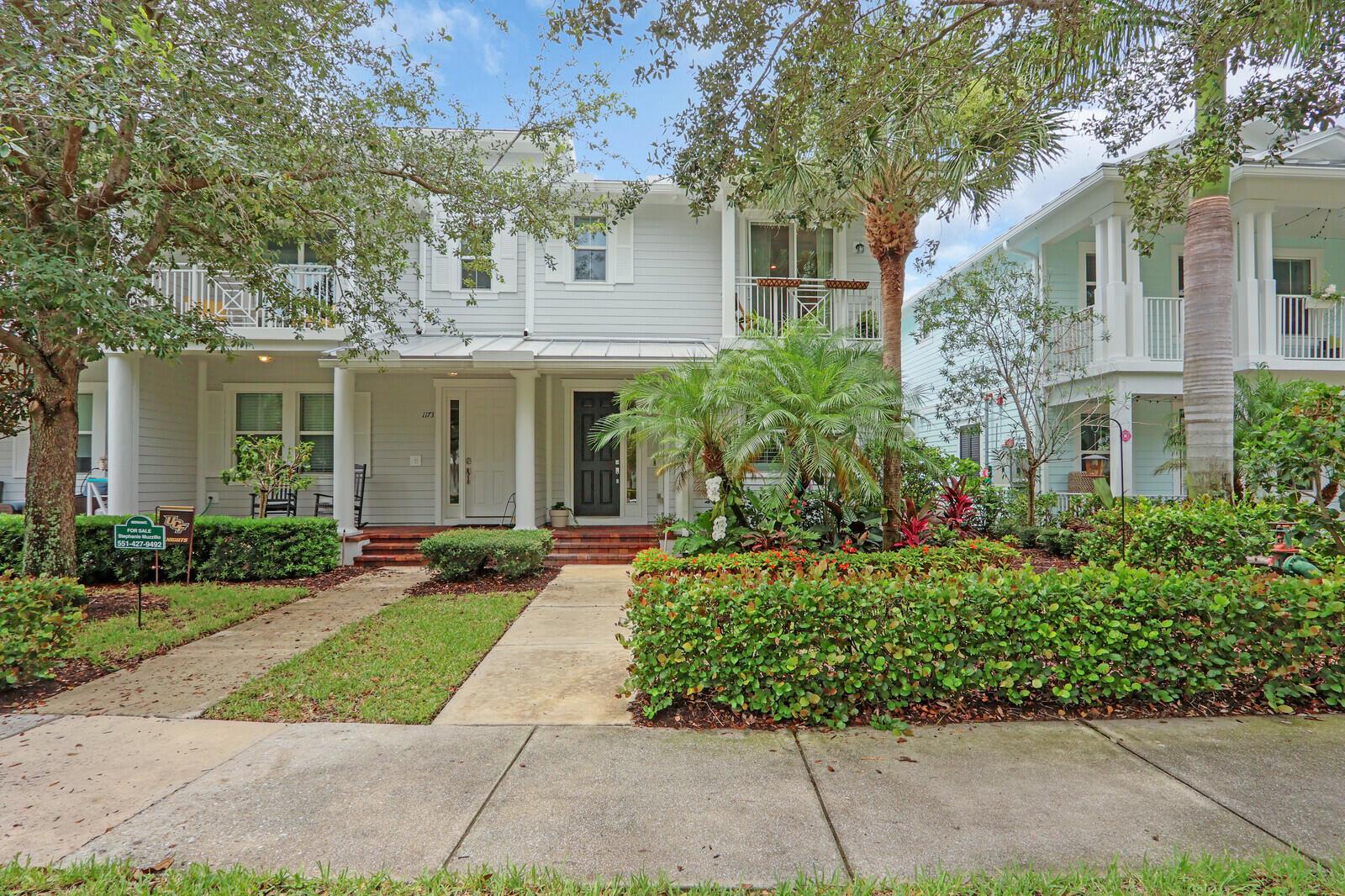 Beautifully upgraded, corner townhome is offered as an unfurnished or furnished, annual rental in highly desirable Abacoa Windsor Park community boasting a coastal-vibe, remodeled guest bathroom with deep soaker tub, remodeled under stairwell converted to office space with counter space and filing system drawers separated by beautiful sliding glass door, additional storage space with door passage under stairwell, crown molding throughout, plantations shutters, light wood vinyl flooring, kitchen undermount lighting, surround sound speakers and wiring, insta-hot tankless water heater in garage for space and energy conservation, plus additional recess and accent lighting in living room. Ceiling fans in every room and ADT security system monitoring included.
