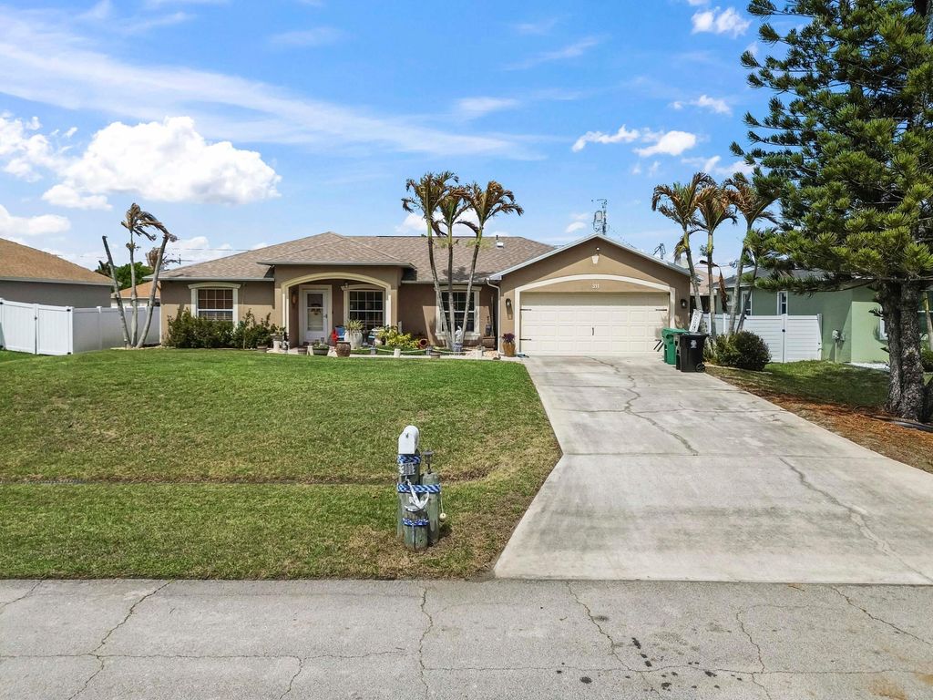 Photo of 311 SW Dustin Avenue, Port Saint Lucie, FL 34953 (MLS # B26004384)