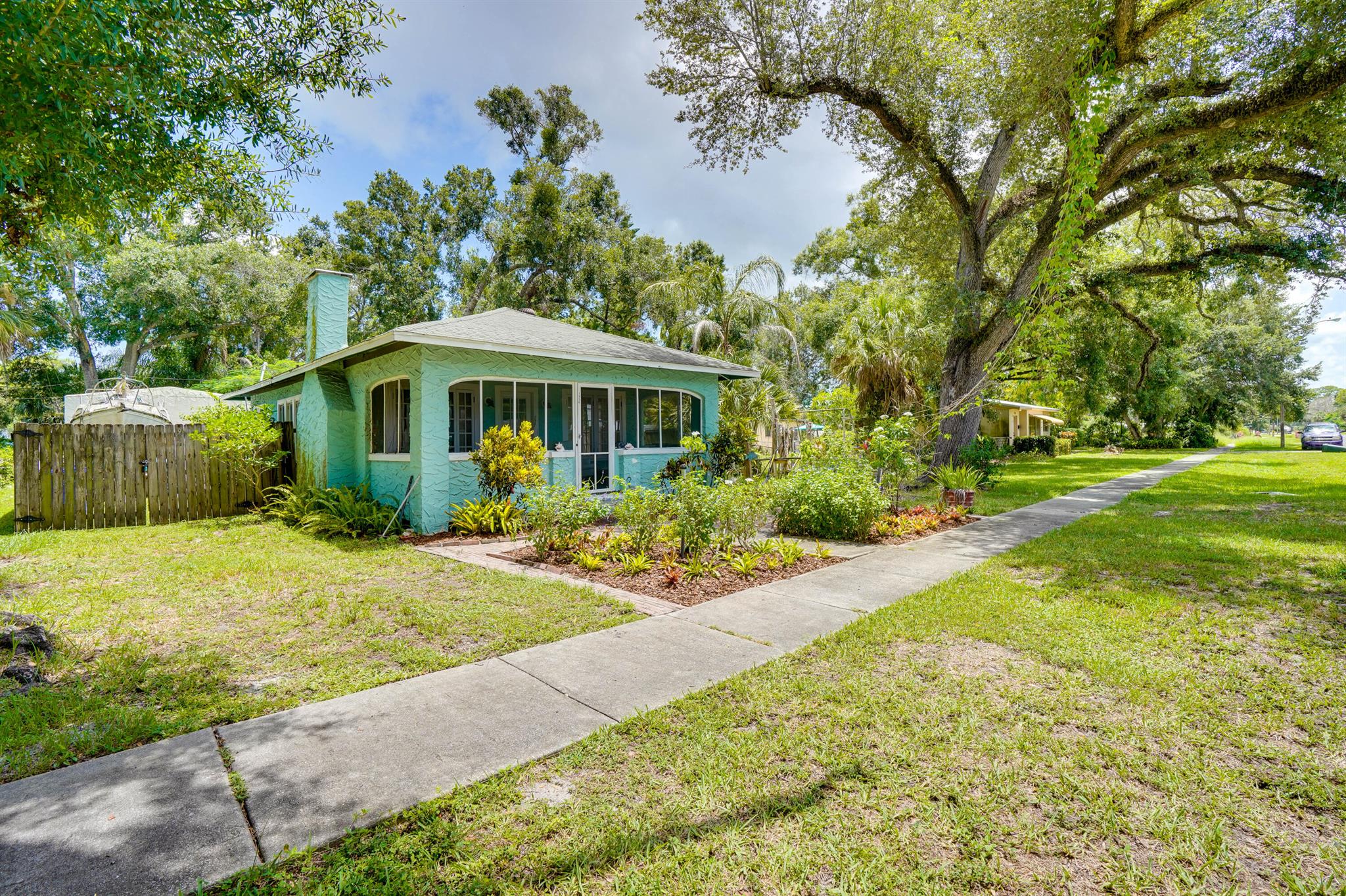 Charming 1920's bungalow in the heart of Vero Beach. 2 Bedrooms and 1 bathroom with a separate 2 car garage. Mixed use property that can be used for an office or a home. Wood flooring throughout. Home features a front patio and Florida room in the back of the home. Wood burning fireplace. Concrete block home on a .32 acre lot. Call today for a private showing.