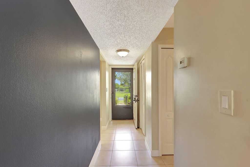 Photo of 5393 SE Miles Grant Road #104, Stuart, FL 34997 (MLS # R10992025)