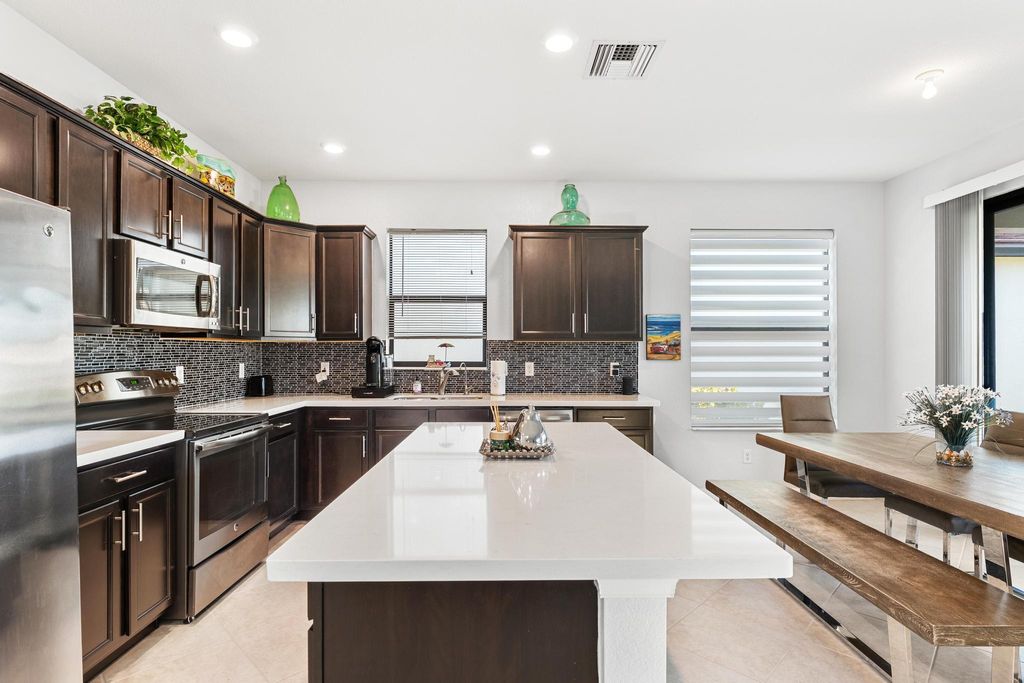 Photo of 7188 Sandgrace Lane, Lake Worth, FL 33463 (MLS # B26022762)