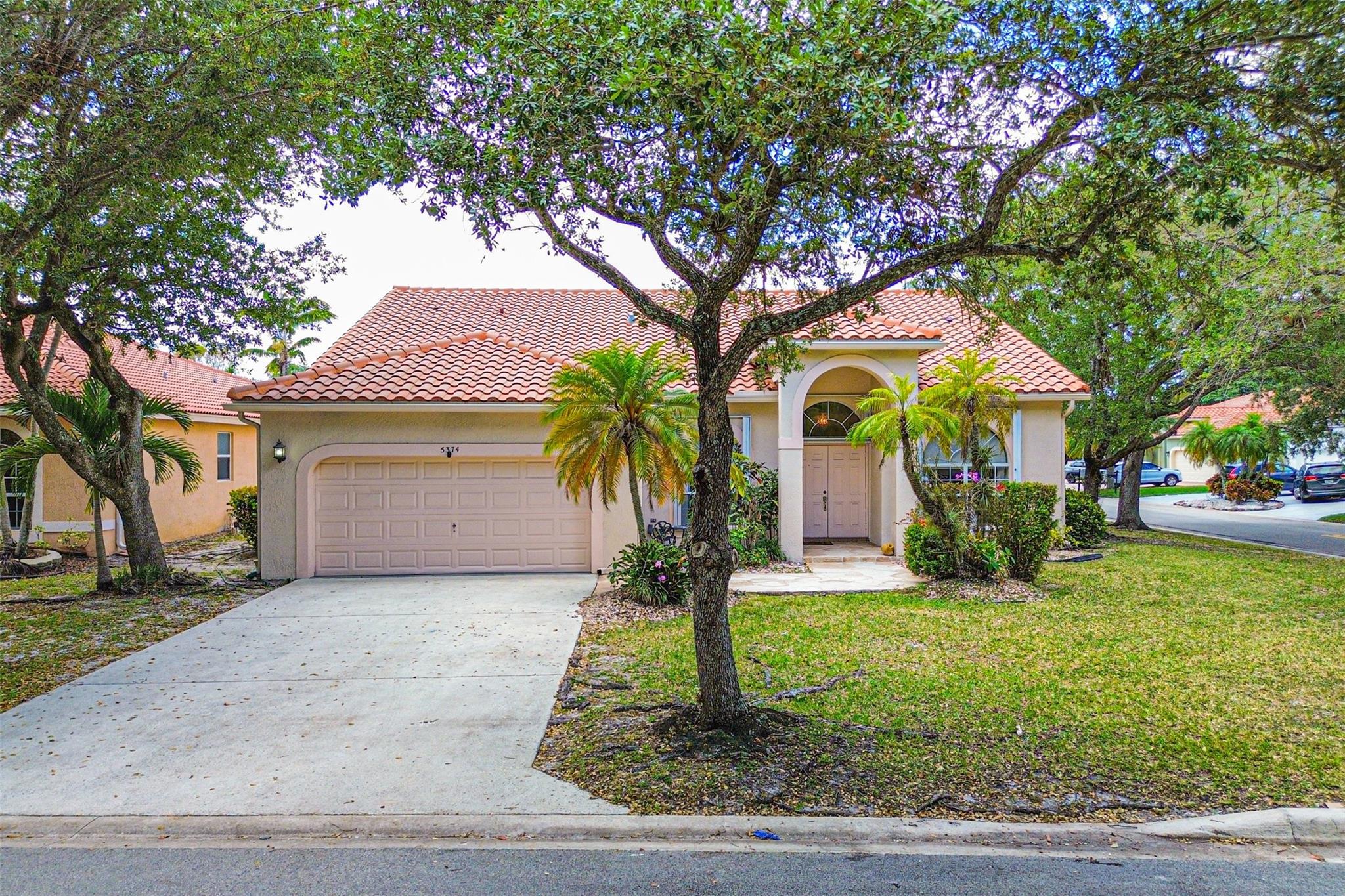 SELLER IS MOTIVATED!! Fall in love with this gorgeous 4-bedroom, 2-bathroom corner-lot beauty in vibrant sought after Coral Springs! Step into a bright, open layout with soaring ceilings, a sleek modern kitchen, and stylishly upgraded bathrooms. Perfect for entertaining or relaxing, the spacious backyard is a true oasis—featuring a covered patio, tranquil built-in pond, fruit trees, and your very own vegetable garden. Roof is just 9 years old; A/C and water heater are 6 years old. Located near top schools, parks, shopping & dining—Perfect Blend of Style, Function and Nature.