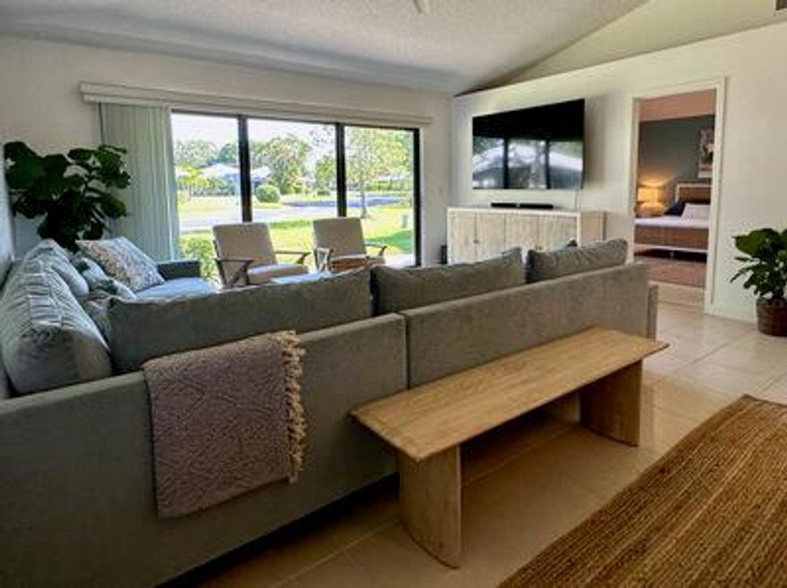 Your perfect winter getaway in Florida! This beautifully decorated and updated corner cottage is your prime getaway for the winter of 2026. The primary and guest bedrooms both feature queen beds and have TVs. The back patio has a BBQ grill and chaises for your enjoyment of the outdoor living space. The cottage is conveniently situated within steps to the heated community pool featuring brand new furnishings. PGA is a gated community with beautiful trails, parks and lakes. PGA Resort offers dining, shopping and spa. Enjoy a wide selection of restaurants, gourmet markets, farmers markets, tennis, pickleball, golf, and spectacular retail all within minutes.