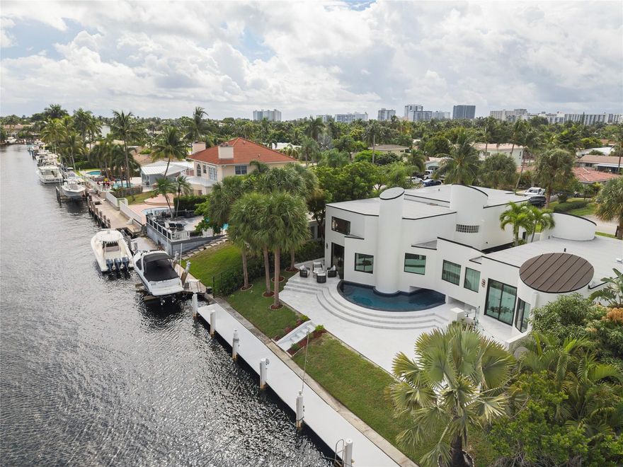 *NO FIXED BRIDGES* Discover the epitome of luxury living with this completely renovated, designer-inspired home such as a new roof, all new zone AC units, new impact glass windows and pool equipment, new tankless hot water heater. Situated just 5 minutes walk from Publix, Whole Foods, and close to beaches and the pier,with a canal that draws 5-6± ft and an impressive 80± ft seawall. Contemporary elements like a pool design that wraps under the primary bedroom and eye-catching canal views. The kitchen is a chef's dream, complete with an island and an adjacent dining area for entertaining. The ground-level primary bedroom is a sanctuary of comfort, offering 10 ft ceilings, porcelain tie floors, a wet bar, two spacious walk-in closets,, a tub, and a large​​‌​​​​‌​‌​​​‌‌​​​‌‌‌​​‌​​‌‌​​​​ shower;