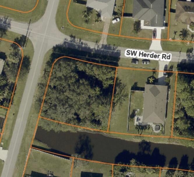Photo of 1498 SW HERDER Road, Port Saint Lucie, FL 34953 (MLS # B26079635)