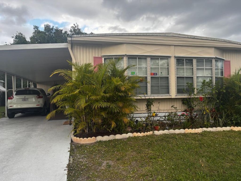 Photo of 14 SE Novedades, Port Saint Lucie, FL 34952 (MLS # R11065324)