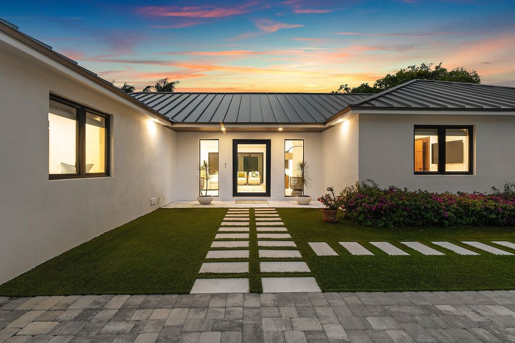 Photo of 1099 S Atlantic Drive, Lantana, FL 33462 (MLS # B26012910)