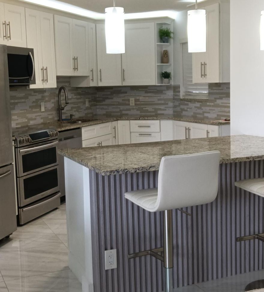 FURNISHED, ANNUAL RENTAL, ALL AGES, RENT INCLUDES INTERNET, CABLE TV AND WATER. 24 hour manned gate in desirable Boca Raton. Completely renovated 2 b.r. 2 bath,  2nd floor w/elevator. 1,550 s.f. incl. the large screened-in patio. Great view. Custom kitchen, granite counters, stainless appliances, full size washer/dryer in unit. Sofa bed for guests. Tile floors throughout. Large master bedroom, walk-in closet, walk-in shower. Relax in the soaking tub in the master suite. 3 tv's. Amenities inc, 4 heated pools, saunas, 2 tennis courts, pickleball, gym rooms, BBQ grills, walking areas. Friendly community. 5 miles to the beach, close to shopping, restaurants, I95, turnpike. Great schools. 700 credit score and good income to qualify. No pets. Assigned parking and guest spaces.