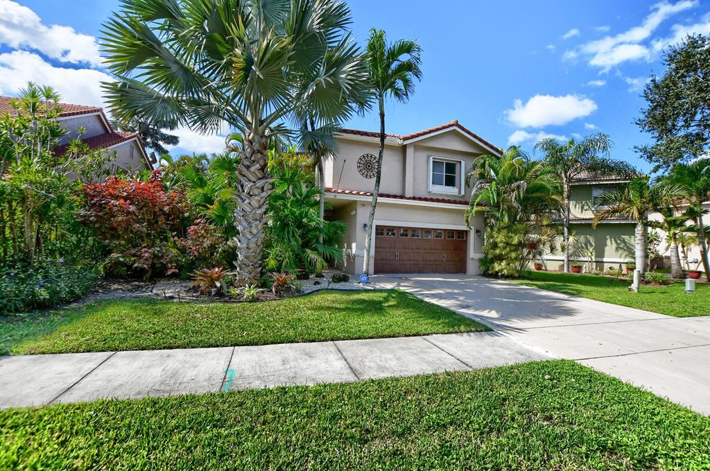 Photo of 6311 NW 58 Way, Parkland, FL 33067 (MLS # R10923776)