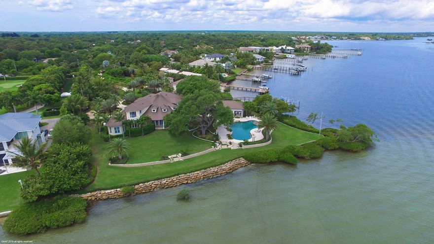 Boasting 599 feet of waterfrontage and incredible, panoramic views of the River, this private oasis located on the wide-waters of the Loxahatchee River has reset the standard of luxury in South Florida. The custom estate home vaunts expert craftsmanship and an array of state-of-the-art features that will leave you simply amazed. Engulf yourself in excellence as you wander the nearly 3 acres of exquisite property discovering the hidden treasures of an unmatched outdoor living and entertainment space. 

Lose track of time enjoying the Florida sun while floating in the over-sized pool, or relaxing in the expansive loggia with a fire place. The spacious rear lawn backs up to a large dock with two boat lifts and unobstructed water views as far as the eye can see. Once inside, the transitional design and details are unparalleled and compliment the water views. The gourmet kitchen's open floor-plan with Wolf, Subzero and Miele appliances is an entertainers dream. Owners escape to tranquility in their elaborate, first floor master suite, thoughtfully paired with a luxurious spa-like en suite. Other home features include an over-sized game room, a large office, and two laundry rooms. Newly added in the renovation is the guest house with a five-car garage and ample storage with a tackle room. The one-bedroom apartment has its own kitchenette and living space.  
Your private oasis, Jupiter's unmatched location and lifestyle along with the miles and miles of blue water, combine to make Jupiter your very own tropical dream town.