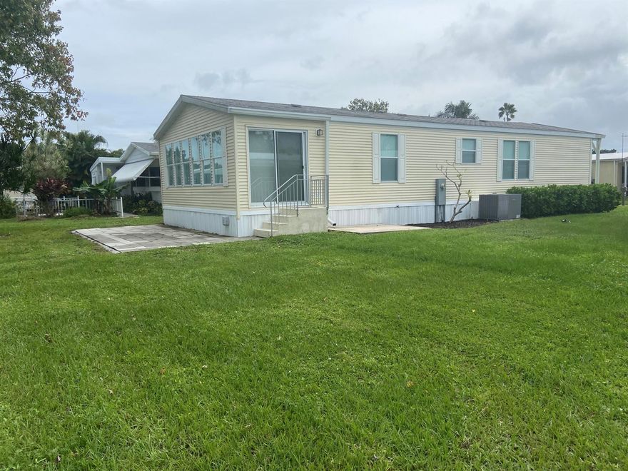 Prime location PET friendly lake lot walking distance to the active clubhouse with pool, tennis, pickle ball and numerous activities in this great 55+ community! Offered fully furnished and fully updated as shown, with indoor laundry. There is a boat launch with access to Saint Lucie River and to the intercoastal. Great fishing and ever-changing views of the sunsets! This 2006 Palm Harbor model will not disappoint with new central air unit 2024, vaulted ceilings and great ambient lighting including skylights in both baths! Sitting on leased land, will require residency approval from Spanish Lakes 55+ communities that we will walk you through. Please call ME today to schedule your showing as this one won't last long! Be the lucky homeowner of this beautiful pristine home!