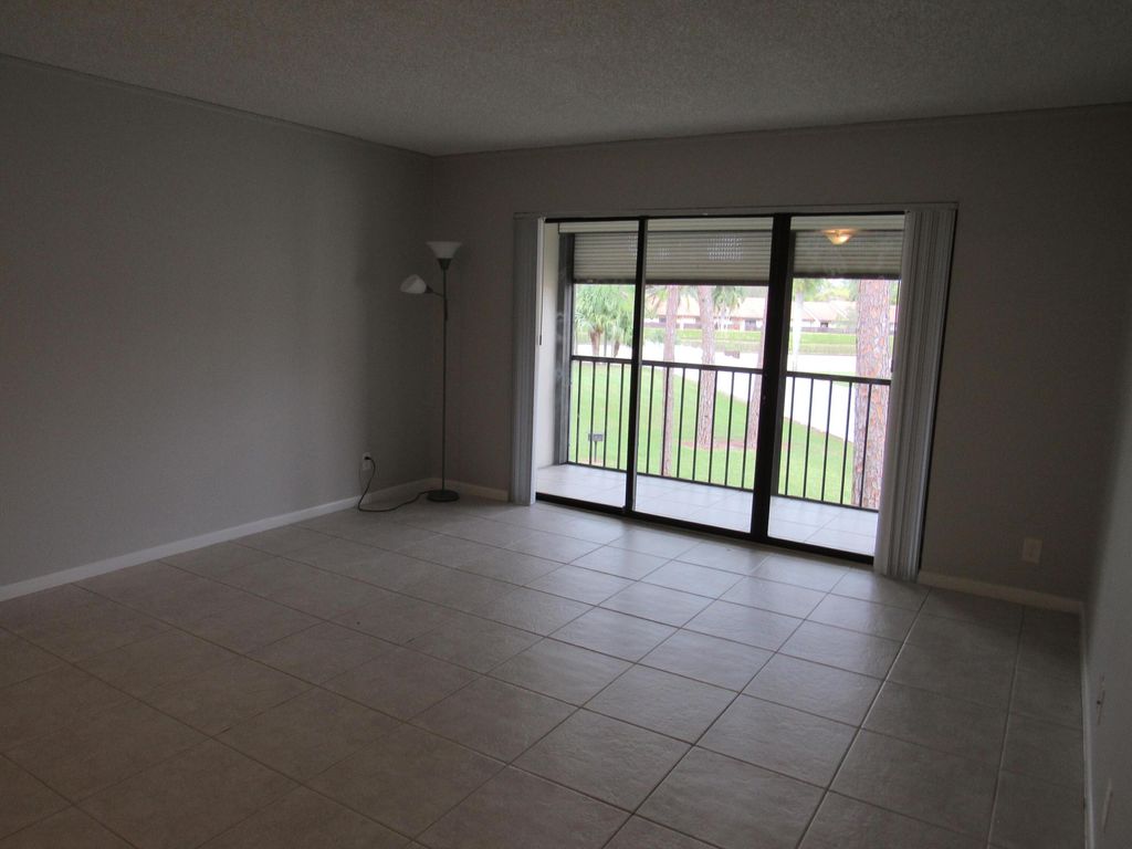 Photo of 703 Sunny Pine Way #G2, Greenacres, FL 33415 (MLS # B26020460)