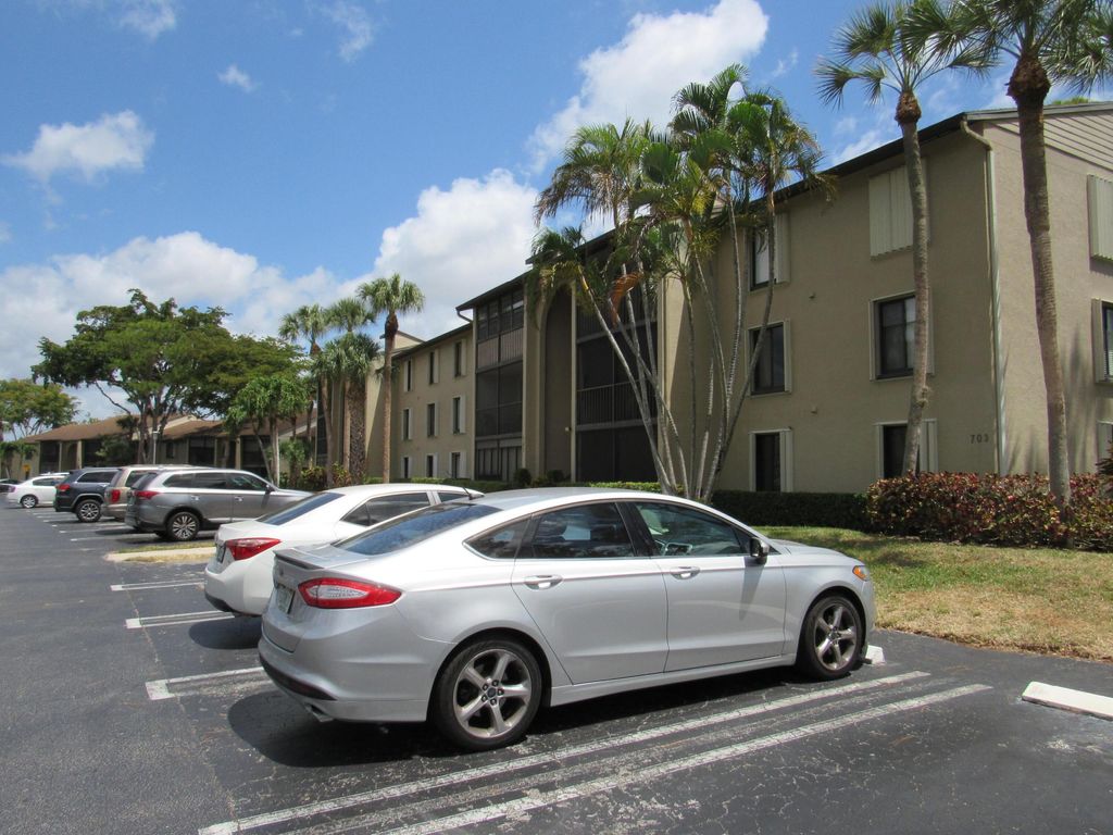 Photo of 703 Sunny Pine Way #G2, Greenacres, FL 33415 (MLS # B26020460)