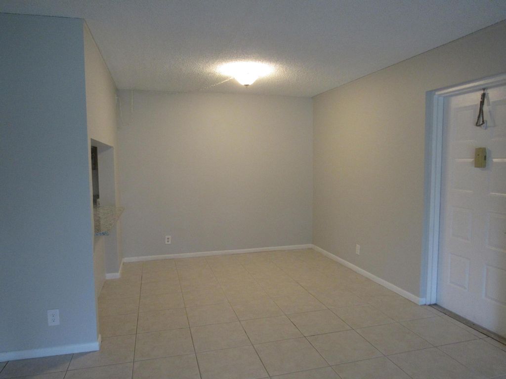 Photo of 703 Sunny Pine Way #G2, Greenacres, FL 33415 (MLS # B26020460)