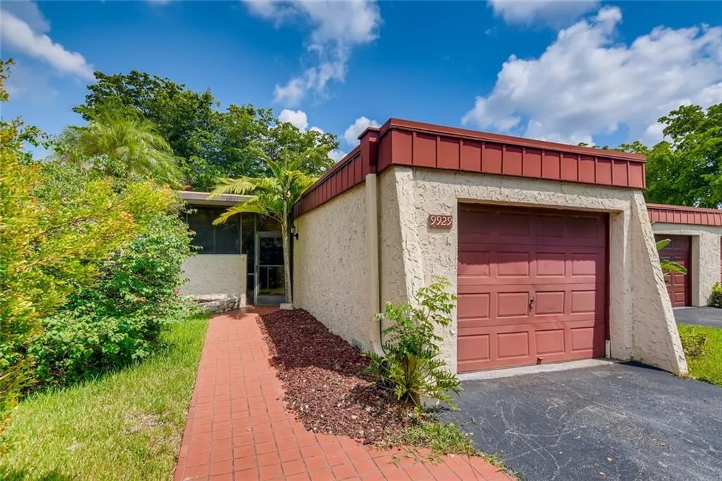 Photo of 9929 NW 65th Ct, Tamarac, FL 33321 (MLS # F10294237)