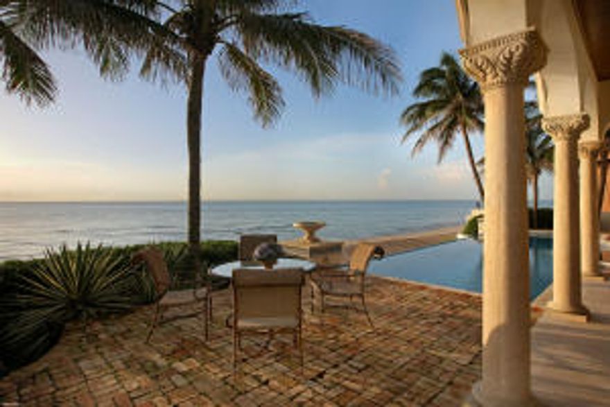 ON THE BEACH IN PALM BEACH!  Nestled in a private cul-de-sac this oceanfront Mediterranean is the best priced direct oceanfront in the area! Water views from nearly every room, covered loggia by  the pool & spa, covered summer kitchen, beach side powder room, club room with bar, 2 car garage, generator, even has auto window-washers!  Relax and enjoy this oceanfront escape.