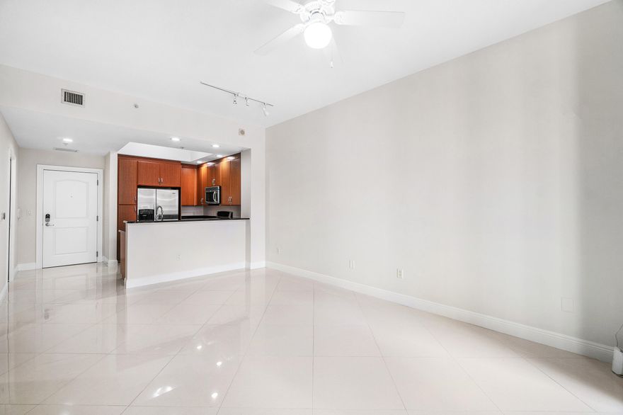 Discover an exceptional opportunity to live in the prestigious Two City Plaza, a premier full-service building perfectly located in the heart of Downtown West Palm Beach. Situated just across from One Flagler and minutes from all of downtown's top destinations, this stunning 1-bedroom, 1.5-bath residence offers a sophisticated urban lifestyle. Boasting soaring 10.5' ceilings and south-facing exposure for natural light, the condo features beautiful modern flooring, freshly painted interiors, updated lighting (not shown in photos), and an open-concept kitchen. Primary Bedroom has new carpeting, large walk-in closet and 2nd closet and fabulous bathroom with dual sinks, separate tub and shower. The private balcony perfect for enjoying the Florida sunshine. 1-garage parking space is included.  This full-service building boasts exceptional amenities; 24-hr security, concierge, roof top pool, hot tub, sauna, steam room, fully renovated state-of-the art fitness center/gym, new outdoor kitchen w/ BBQ area and all new Restoration Hardware furniture, outdoor & indoor movie theaters, club room, table tennis, lanai courtyard w/ water feature, renovated roof top dog park area, complimentary valet parking & exceptional staff. Unbeatable location and perfectly positioned in the heart of Downtown West Palm Beach, Two City Plaza is adjacent to One Flagler and 360 Rosemary office spaces, providing ultimate convenience for professionals. Just 1-block from the bridge to Palm Beach Island, residents enjoy effortless access to Worth Avenue's world-class shopping, award-winning dining, and pristine beaches. Approx. 7-minutes from PBIA airport, ensuring seamless travel. Experience luxury, convenience, and sophistication in one of the most desirable locations in South Florida.